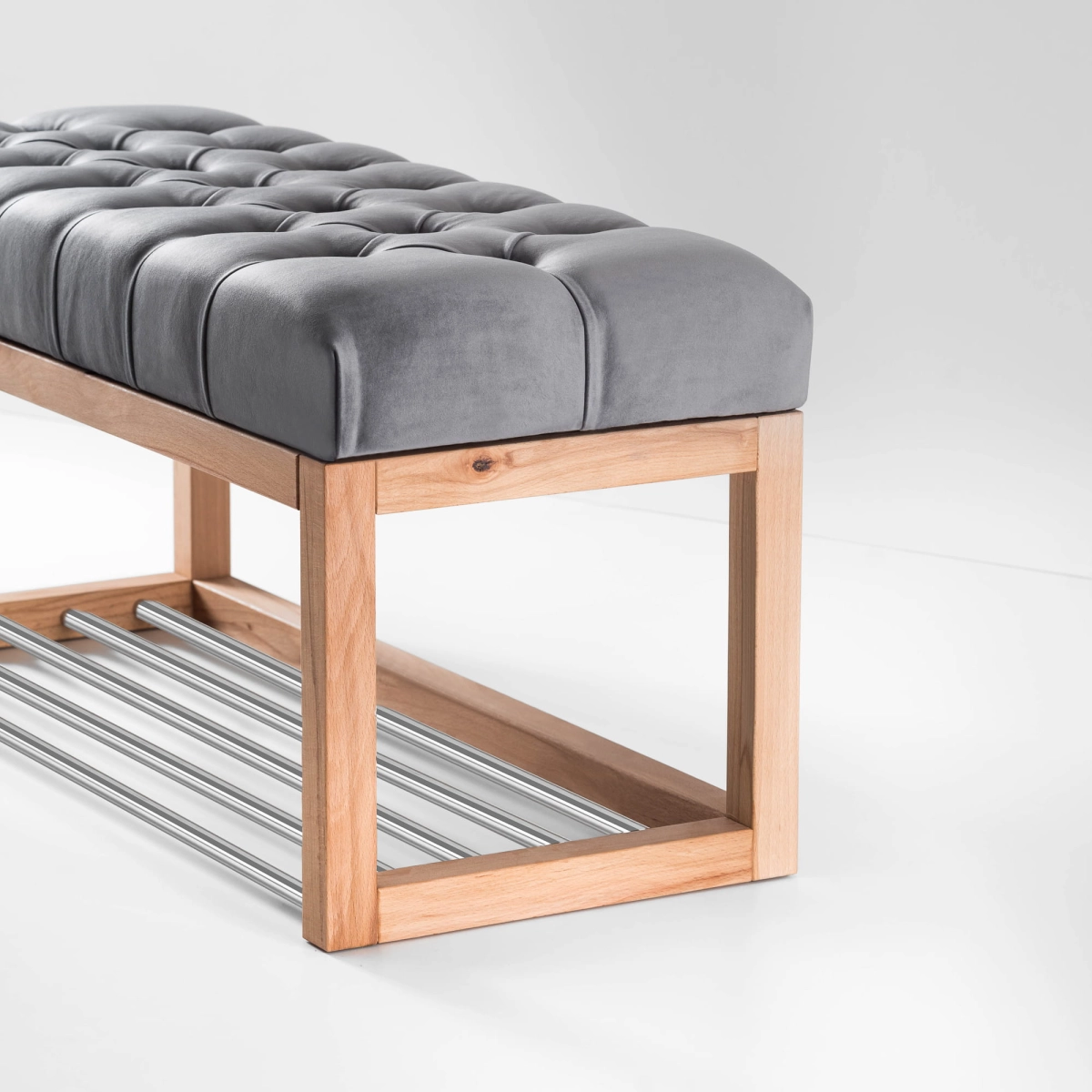Bench with grey quilted upholstery, shoe shelf and light wood