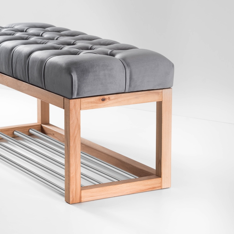 Bench with grey quilted upholstery, shoe shelf and light wood