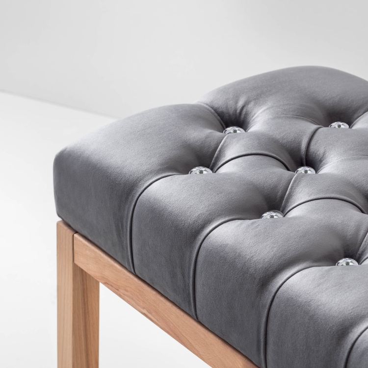 Stylish hallway bench with grey quilted seat and one practical shelf