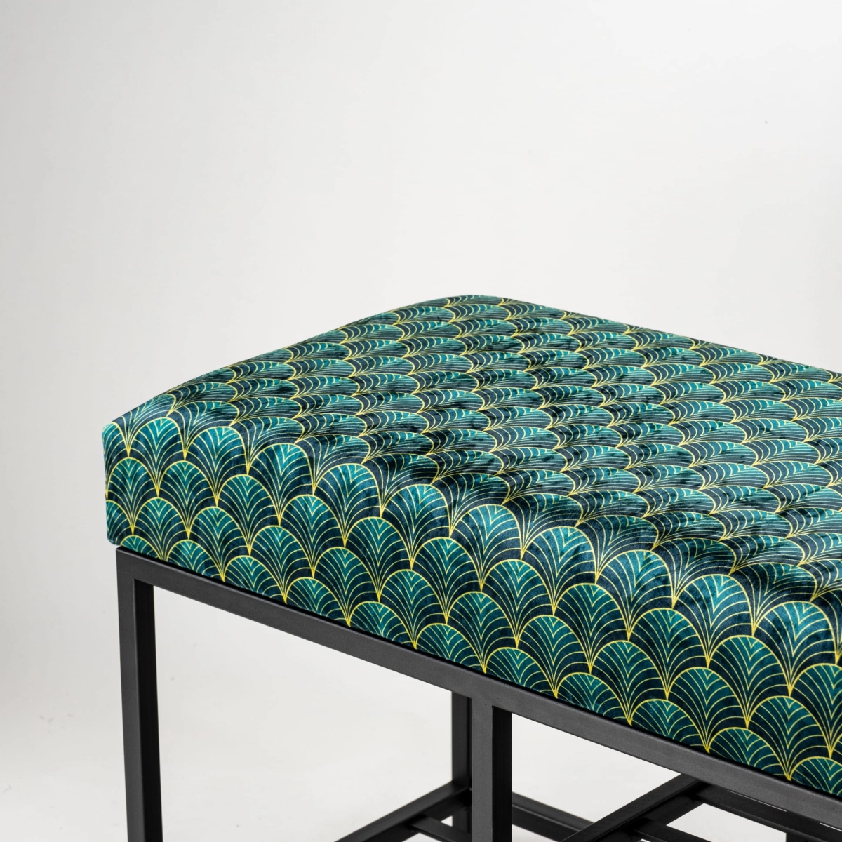 Upholstered loft-style bench on a metal base
