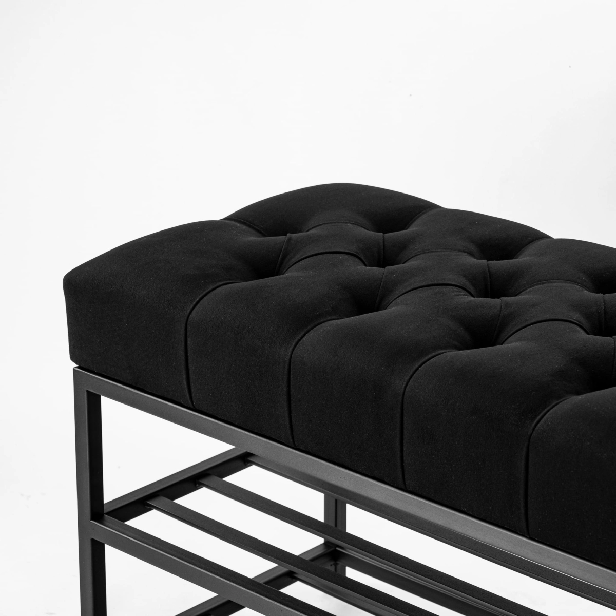 Black quilted bench on a metal base