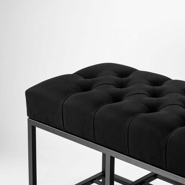 Black quilted bench on metal base