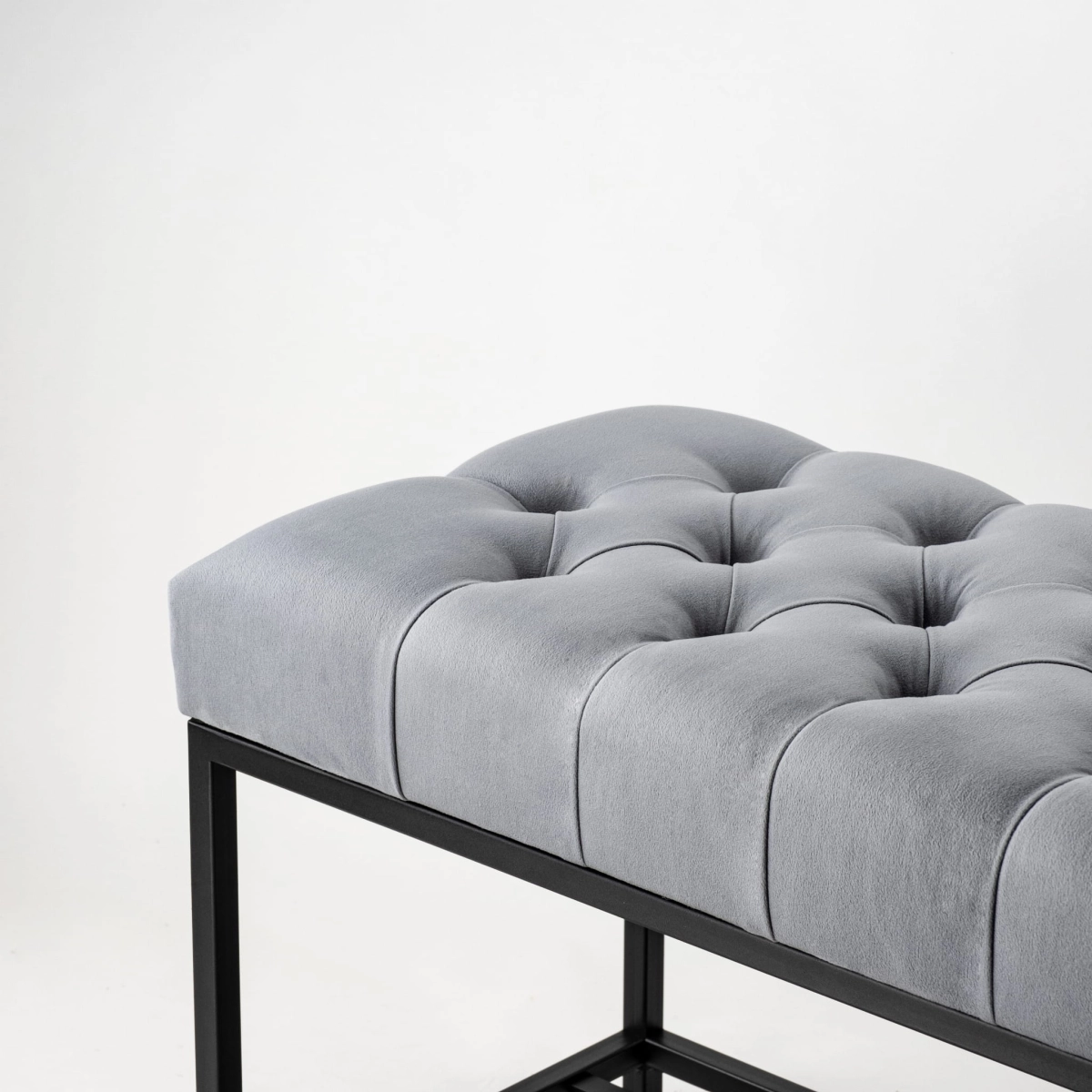 Grey quilted bench in industrial style