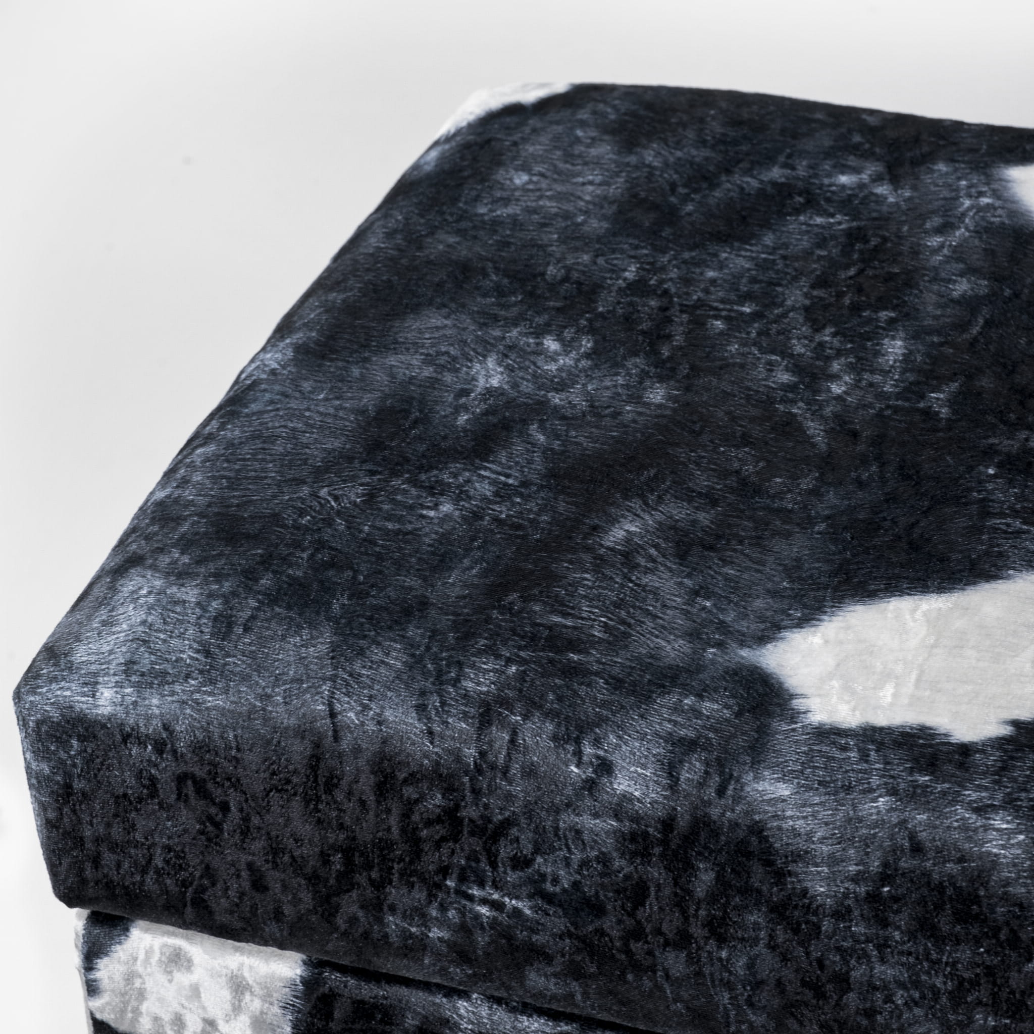 Storage pouffe with cowhide upholstery